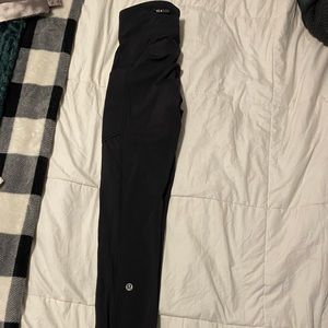 Black lululemon leggings w/ zipper, pockets on side. Great condition, size 0
